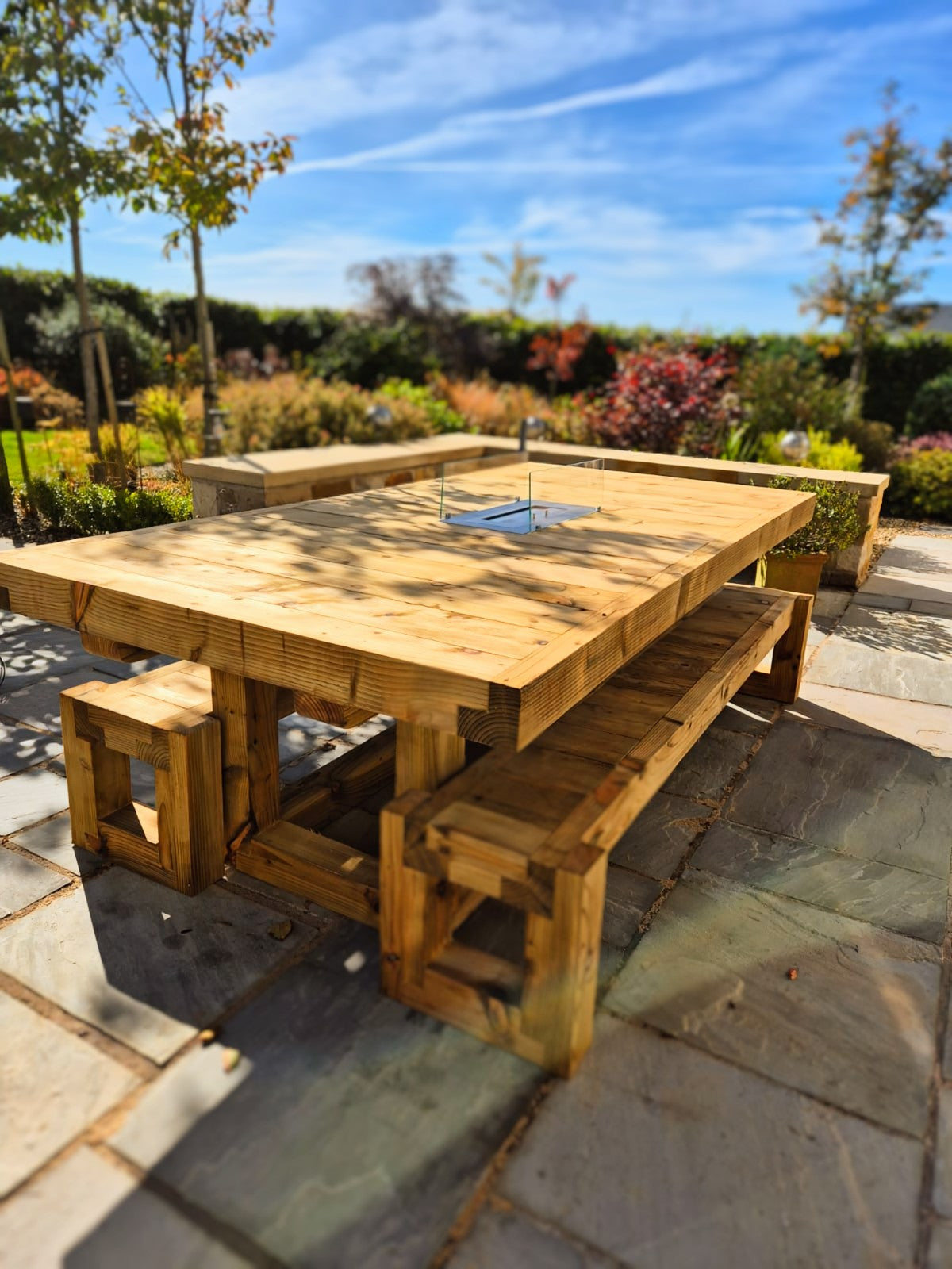 8ft x 4ft Solid wood dining table with matching benches and central firepit