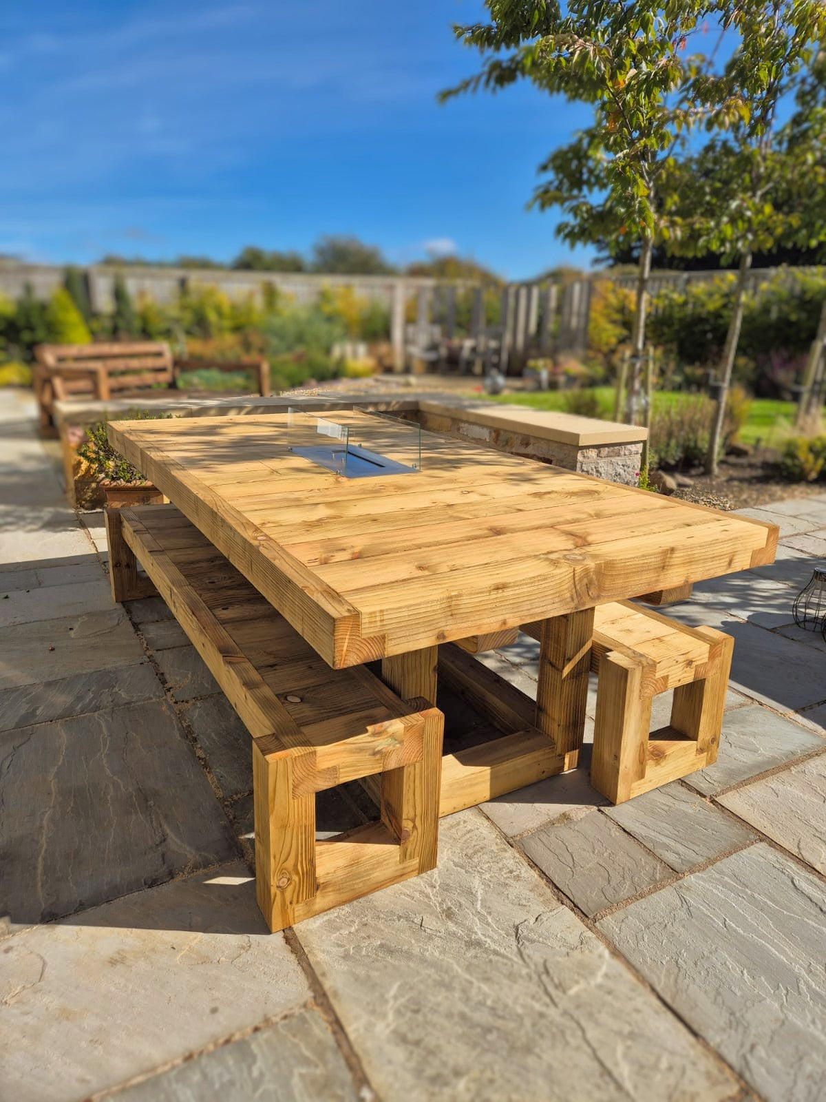 8ft x 4ft Solid wood dining table with matching benches and central firepit